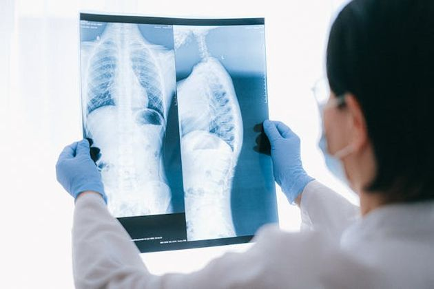Doctor reviewing patient X-rays at Dentamed Holidays’ partner health checkup clinics in Vietnam providing comprehensive medical screenings