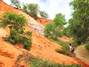  An adventurer ready to climb a hill near the Fairy Stream in Mui Ne-a popular surfing and tourist destination in Vietnam 