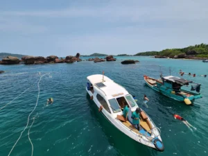  Tourists swimming off the cruise boat in Phu Quoc Island, a popular holiday destination in Vietnam 