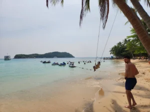  A beach-goer near a swing built on the beach in Phu Quoc Island, a popular holiday destination in Vietnam 