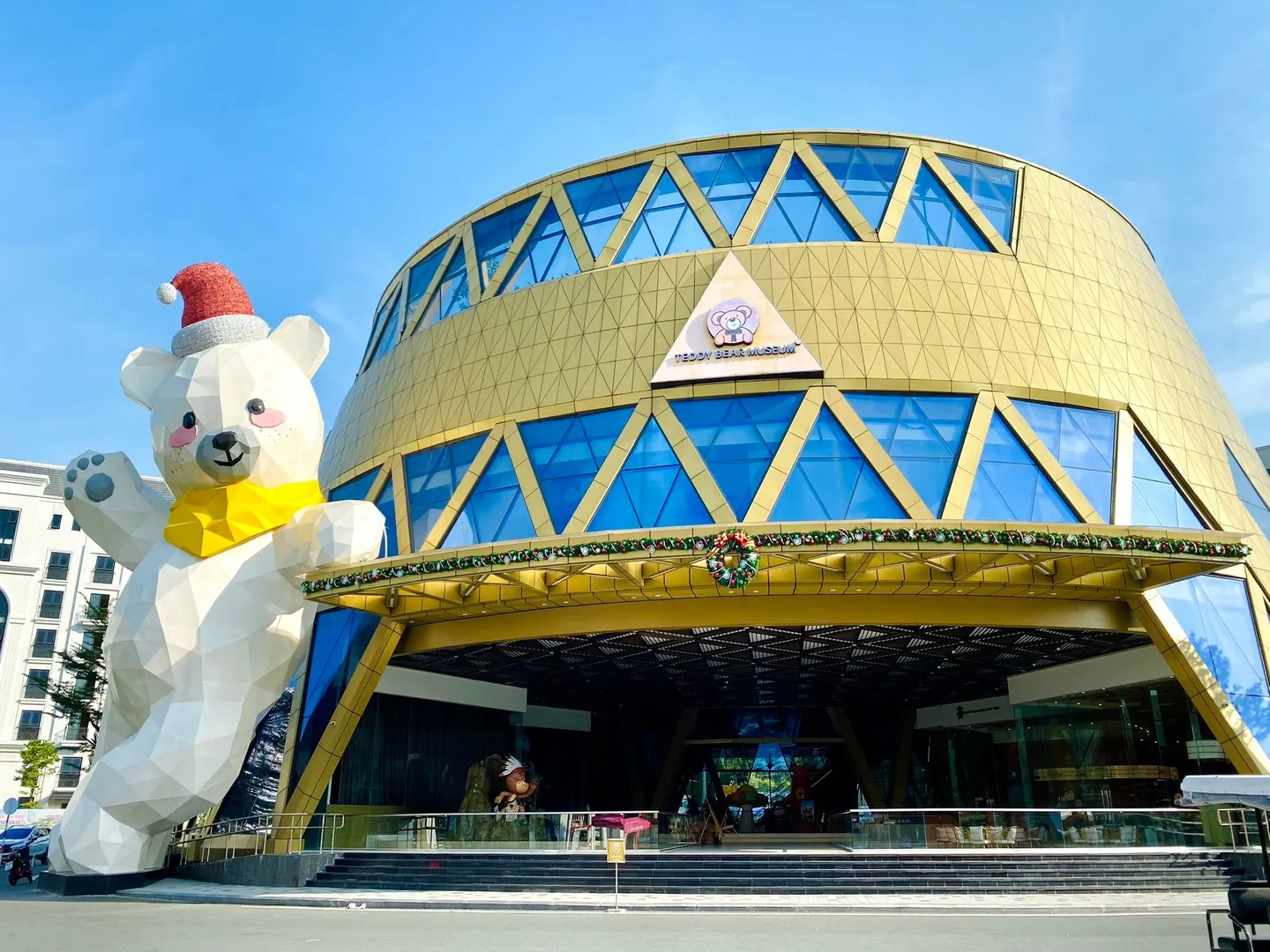  An exterior of Teddy Bear Museum featuring a giant friendly bear statute in Grand World Phu Quoc- a popular tourism destination in Vietnam 