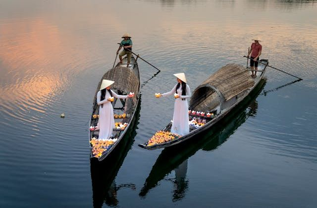  Models posing on traditional fishing boats in Hoi An-a popular holiday destination in Vietnam 